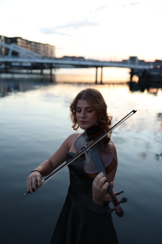 Playing by the harbour at sunset